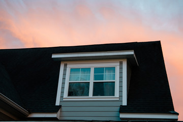 simple new window on a new home with the sunset behind it and copy space