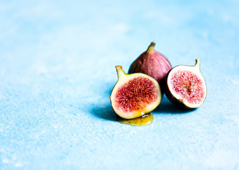 Fresh figs on blue backdrop 
