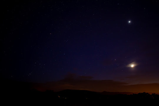 the moon and sirius in the night sky