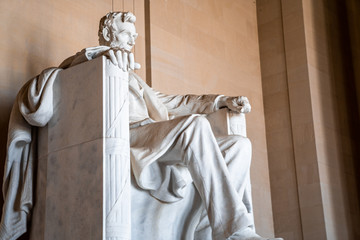 Abraham LIncoln statue inside Lincoln Memorial, built to honor the 16th President of the United...