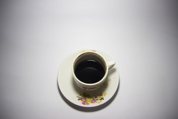 Black Coffee in cup of coffee white background. Top view with copyspace for your text