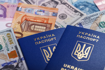 Fototapeta premium Ukrainian passport and currency of different countries necessary for travel and trips abroad.