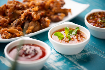 Crispy fried sliced belly pork with spicy sauce
