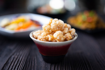 Homemade deep fried crispy pork rind in bowl.  Asian Food