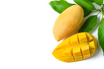 Delicious slide ripe yellow mango with green leaf isolated