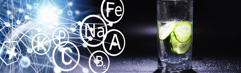 Cucumber water. Drinking water with fresh cucumber. Mineral water. Healthy, mineral-rich, refreshing water with cucumber.