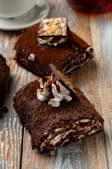 Seasonal chocolate roulade with whipped cream cheese and chocolate
