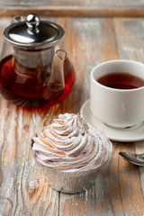 Homemade berry tartlet with whipped burnt crud, served with black tea