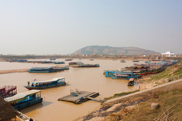 Fototapeta na wymiar Boat on the river. Floating Village on Tonlesap Lake in Cambodia