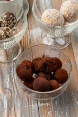 Homemade truffle balls made of chocolate praline and coated in cocoa powder
