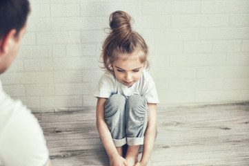 Strict home parenting. Father scolds daughter