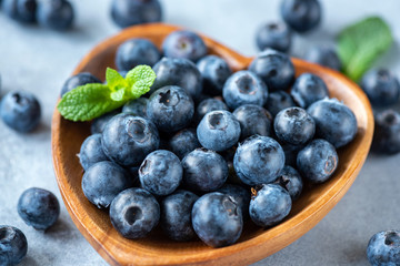 Fresh organic blueberries in a bowl closeup view