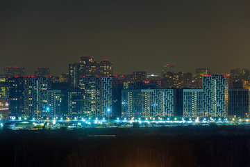 Night city. Construction of residential buildings in Moscow