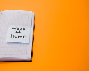 open notebook with a sticker that says 