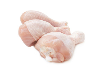 Raw chicken legs isolated on a white background. Three legs for cooking. Close up. Side view.