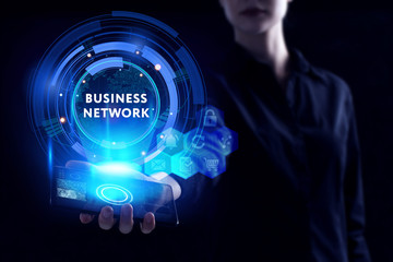 Business, Technology, Internet and network concept. Young businessman working on a virtual screen of the future and sees the inscription: Business network