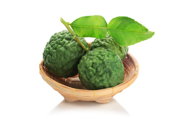 Obraz premium Bergamot in basket material of Essential Oils isolated on white background with clipping path.