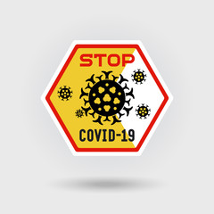 COVID-19 Coronavirus danger warning sign. Includes a stylized virus infection icon. Design contains the ‘Stop‘ inscription. Hexagonal shape design.