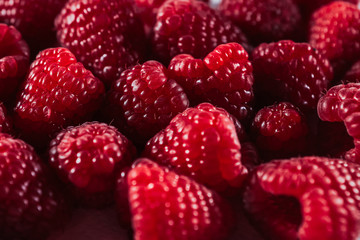 Scattering of raspberries for concept design. Fresh fruit. Organic fruit. Healthy fresh nutrition. Food concept. Summer fruit. Sweet food. Food ingredient pattern. Red berry closeup.