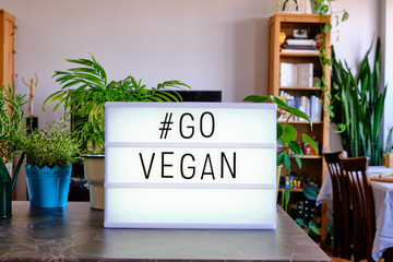 Lightbox written "Go Vegan" with cinema letters. Concept for Veganism. Healthy Lifestyle. Vegan life.
