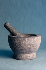 Gray stone mortar with pestle.