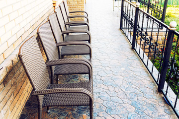 Empty brown chairs on the terrace. pandemic and social exclusion concept. toned