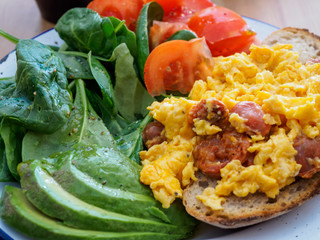 Scrambled egg on toast with salad
