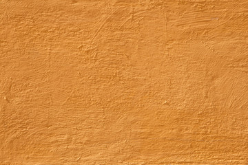 Colorful concrete wall, bright yellow vintage style of cement background paint with small texture details.