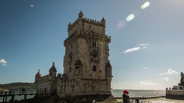 Belem Tower hyperlapse Torre de Belem, with crowd, clouds and boats, Lisbon Portugal
