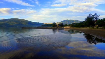Waters reflecting the blue sky.