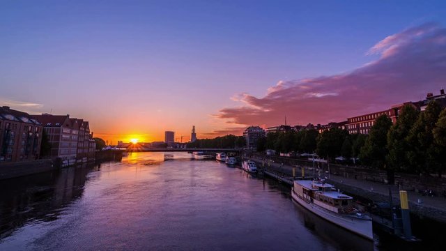 Bremen beautiful sunset timelapse at golden hour over the Weser river in Bremen, Germany, Europe.