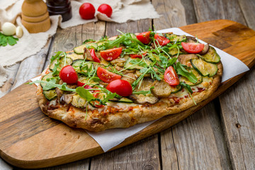 vegetable pizza at the Rome dough, vegetarian pinsa on wooden table