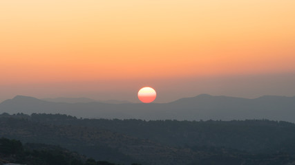 Amazing sunset behind the mountains in Cyprus.