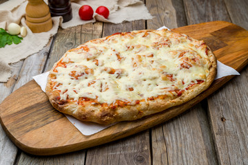 margarita pizza at the Rome dough on wooden table, pinsa