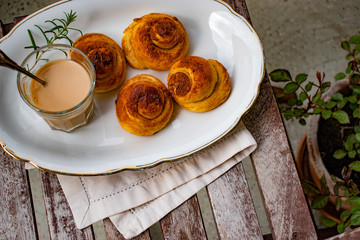 cinnamon rolls on wooden table