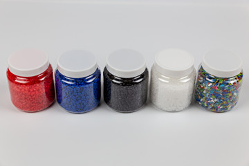 Close-up of plastic polymer granules. hand hold Polymer pellets. polymer plastic. compound polymer.