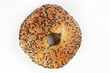 Toasted sliced black seed sesame bagel bread on white background