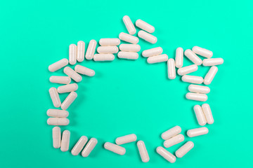 white tablets on a turquoise background. isolate