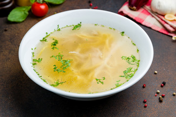 Chicken soup bouillon in a plate