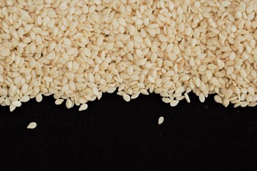 Sesame seeds on a black background