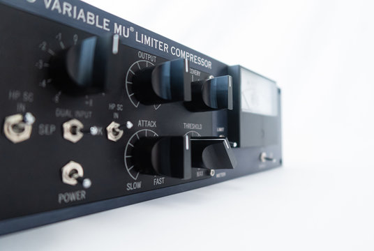 audio, audio equipment, audio system, close-up, closeup, ZURICH, SWITZERLAND - APRIL 4, 2020: Stereo audio studio processor and lamp-operated compressor. Mostly used for mastering.