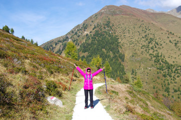 Fototapeta premium young girl smiles happy on mountain trails