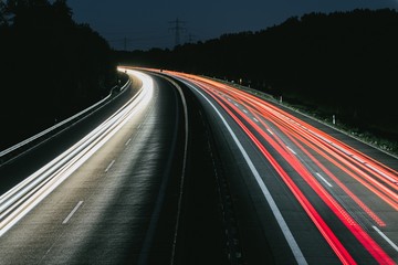 Long exposure of highway through forest