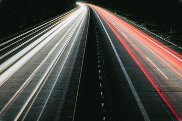 Long exposure of highway through forest