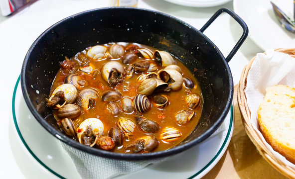 Picture of  tasty baked in sauce snails  in pan