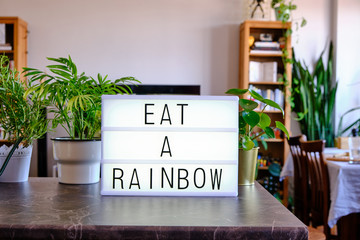 Lightbox written "Eat a Rainbow" with cinema letters. Concept for eating healthy.
