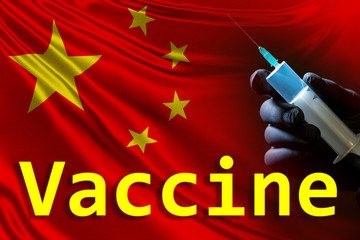 The syringe, the Chinese flag and the inscription vaccine. Development of a cure for coronavirus....