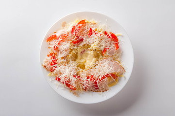 healthy salad in a white plate on a white background. Healthy eating