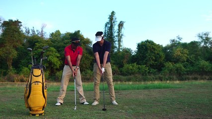 The trainer is teaching golf skills to new golfers footage 4K