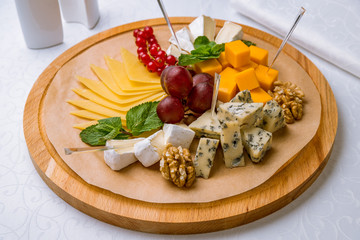 Cheese plate italian food on white table